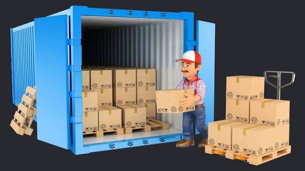 Open shipping container at a loading dock with pallets ready to be received